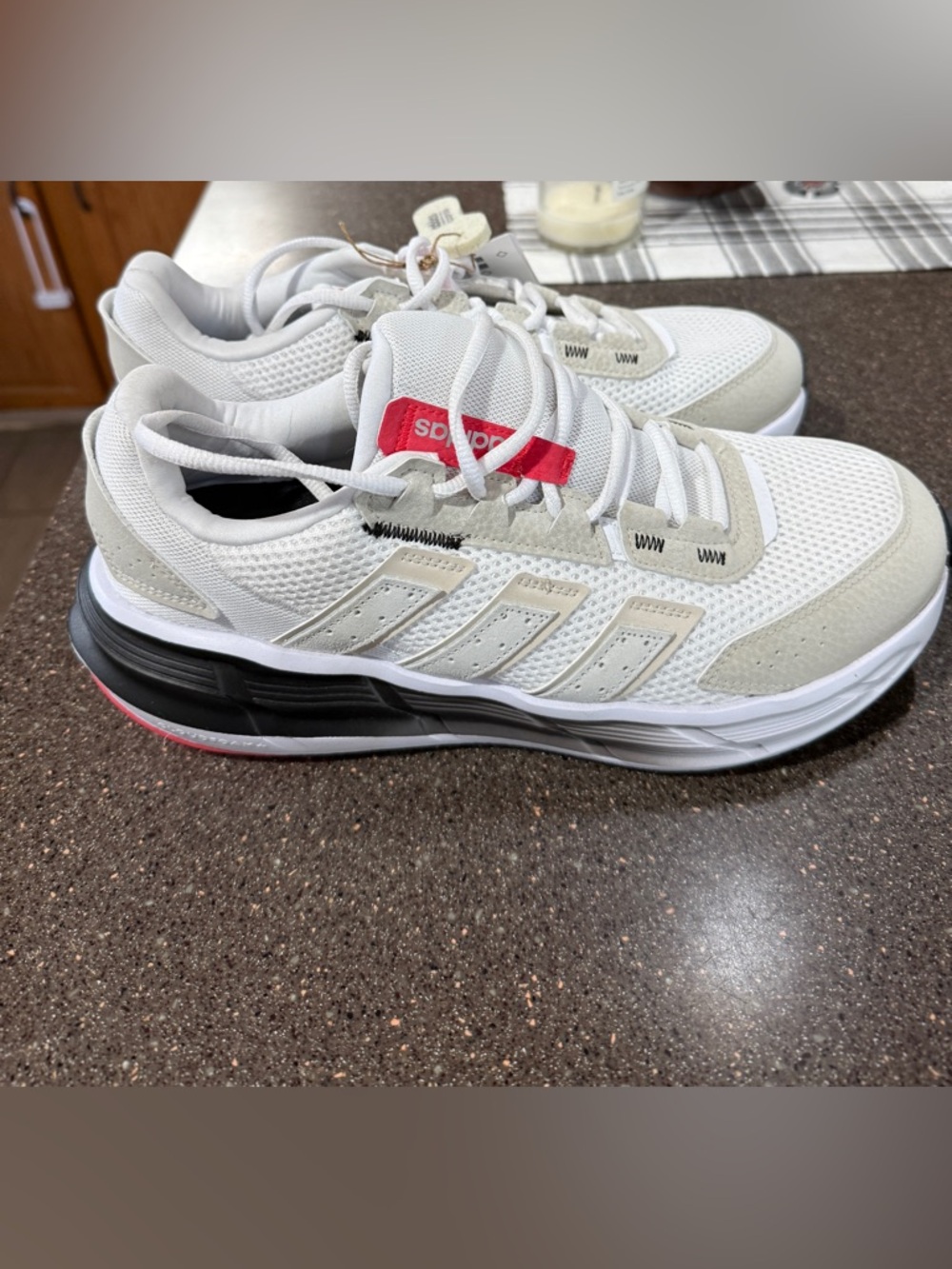 adidas White Sneakers with Black Midsole and Red Tongue Tab